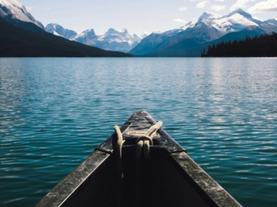 View of mountain lake over canoe boat
